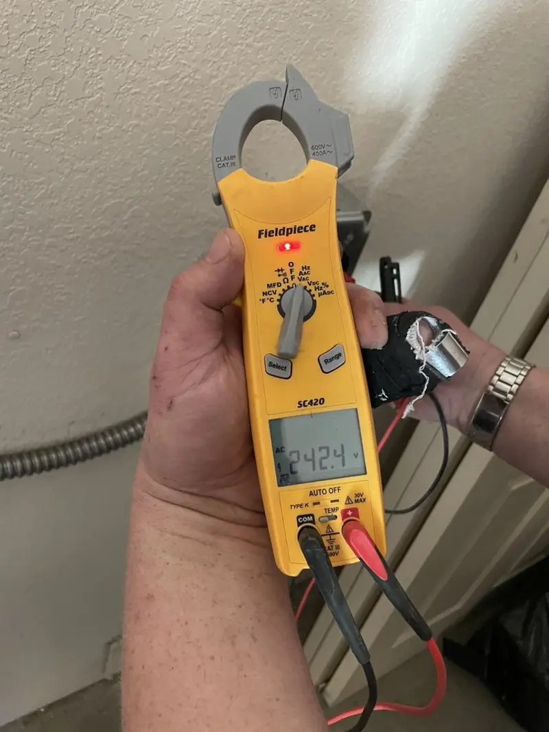 Voltage testing with clamp meter during Recessed Lighting Installation in Robstown